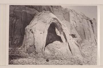 Arch in the Sky; South end of Cummings Mesa.  It may have been a discovery on 1954, Sep. 25.  It has previously been seen by thousands but only a close approach would reveal the opening back of it